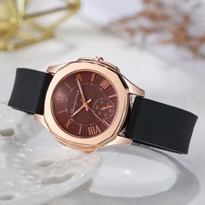 Elegant rose gold women's watch with dark brown sunburst dial and black silicone strap