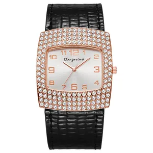 Square rose gold watch for women with rhinestone bezel and black snake skin leather strap