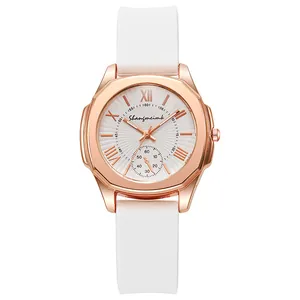Macro detail of octagonal rose gold case with white textured dial and silicone strap