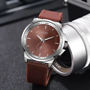 Men's fashion quartz watch with brown rubber strap and textured dial in silver case