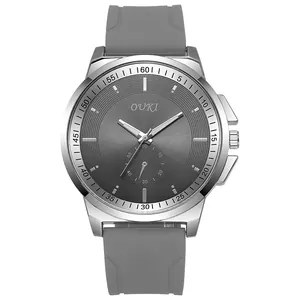 Detail of OUKI quartz watch with grey silicone strap and textured grey dial in silver case