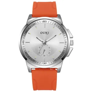 Macro view of silver quartz watch with orange silicone strap and CD-texture dial