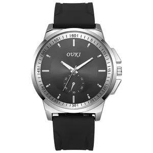 Close-up of OUKI quartz watch featuring a textured grey dial and black silicone strap