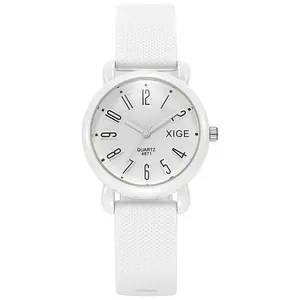 Detail view of the white silicone watch strap with non-slip dot texture and quartz dial