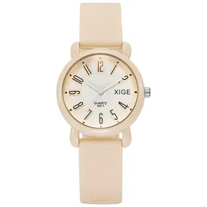 Detail of cream silicone watch strap with anti-slip texture and quartz dial