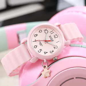 Pink quartz watch for girls with star pendant and wave texture silicone strap