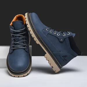 Detailed side view showing navy suede upper and durable khaki rubber sole on work boots