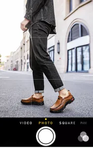 Close-up of brown leather outdoor shoes with moccasin stitching and non-slip rubber soles