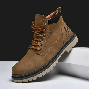 Detailed view of brown leather work boots featuring thick rubber soles and branding