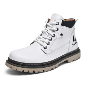 Detail view of the white high-top leather work boot featuring a thick rubber lug sole