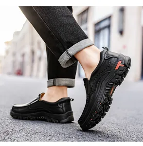 Close-up of durable black outdoor leather shoes with stitched details and rubber grip sole