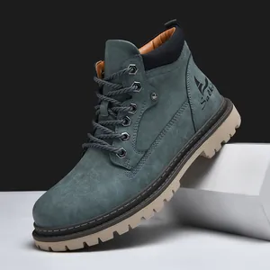 Detailed side view of men high-top work boots with matte leather and thick rubber sole