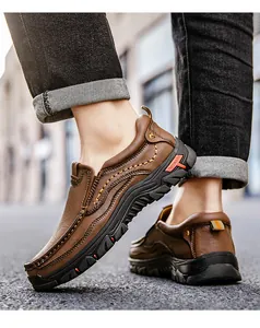 Detail of hand-stitched brown leather outdoor shoes with thick anti-slip rubber soles