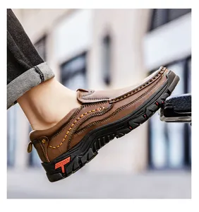 Detail of brown leather slip-on outdoor shoe with heavy stitching and rubber sole