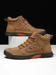 Close-up of brown leather boots with reinforced stitching and durable rubber sole