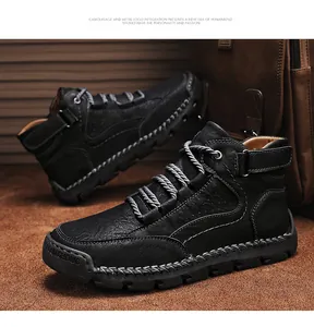 Detailed macro of handmade stitching on black pebbled leather boots with rubber sole