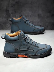 Detail view of LDECK men leather boot showing contrast stitching and orange anti-slip sole