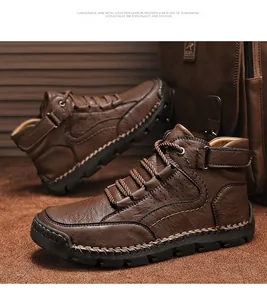Detail of dark brown leather boots with handmade stitching and velcro strap closure