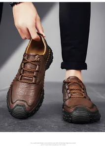 Macro shot of brown leather casual shoe with hand-stitched details and rubber toe cap