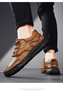Detail of brown leather men's casual shoes with hand-stitched seams and logo
