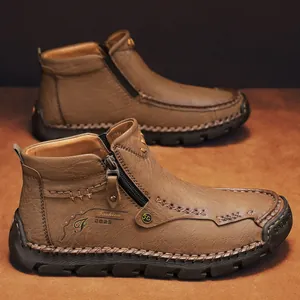 Brown leather men ankle boots with side zipper, handmade stitching, and fashion logo design