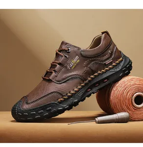 Detail of brown leather casual shoe with artisan hand-stitched sole and side logo