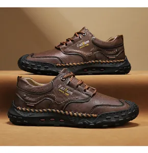 Detailed view of hand-stitched leather on brown outdoor loafers with anti-slip rubber soles
