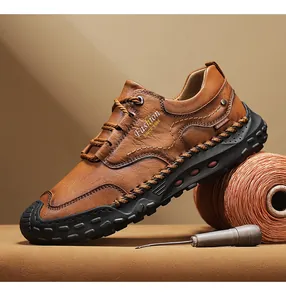Detail view of brown leather loafer featuring hand-stitched seams and anti-slip rubber sole
