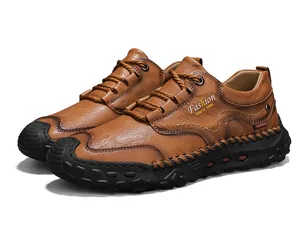 Detail view of brown leather loafers featuring contrast stitching and durable rubber sole