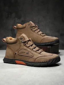 Detail view of brown leather work boots featuring contrast stitching and durable rubber soles