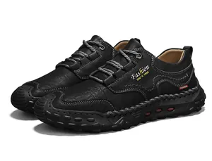 Detail of handmade stitching and fashion logo on men's black casual leather loafers
