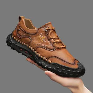 Brown handmade leather loafers for men with rubber anti-slip sole and side logo detail