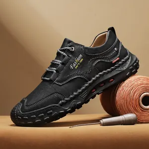 Handcrafted black leather outdoor men's loafers with white stitching and rubber soles