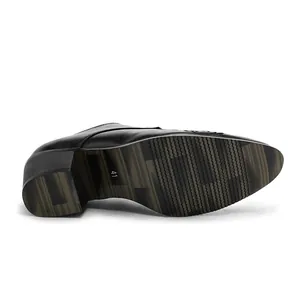 Detail view of the black Cuban shoe featuring a thick square heel and anti-slip sole texture