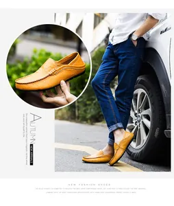 Detailed macro view of yellow leather loafers with fine stitching and metal buckle detail