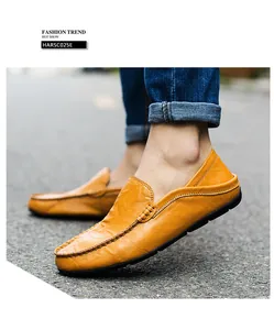 Detail of ginger leather loafers with handmade stitching and flexible rubber sole