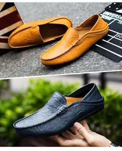 Detail of leather loafers with pebble grain texture and flexible foldable heels