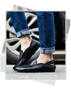 Close-up of black leather loafer showing detailed stitching and premium natural grain texture