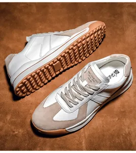 Detail view of GAT style sneakers showing anti-slip gum sole and white suede patchwork