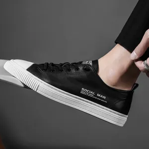 Men's casual black and white leather sneakers with stylish thick soles and side lettering