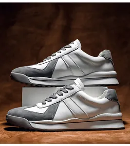 Detail view of vintage white and grey sneakers showing premium suede and leather texture