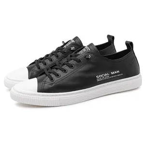 Classic black and white men's low-top casual sneakers with leather-like finish