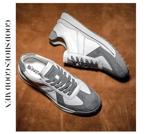 Detailed top view of retro casual sneakers featuring white leather and gray suede panels