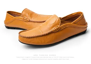 Close-up of brown leather loafers featuring natural texture and handmade stitching detail