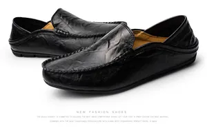 Close-up of black leather loafer showing detailed hand-stitched seams and natural grain