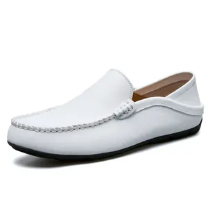 Classic white leather loafers for men with rubber soles shown from a 45-degree side angle