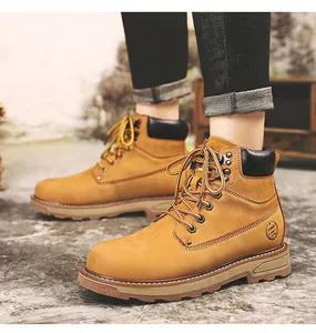 Detailed close-up of classic yellow leather work boot featuring heavy-duty rubber sole and laces