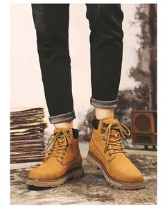 Close-up of wheat nubuck leather work boots with padded collar and durable rubber sole