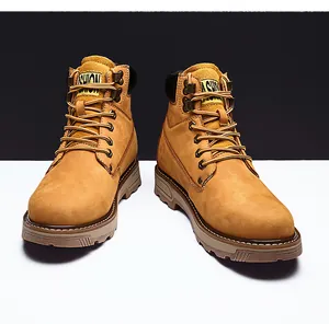 Detail of wheat yellow leather work boots with heavy duty rubber soles and durable laces