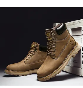 Detail of high-top leather work boots featuring sturdy soles and side sport emblem